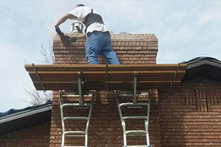 Masonry chimney repair work in progress