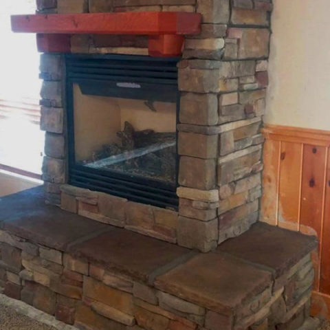 Interior stone fireplace surround