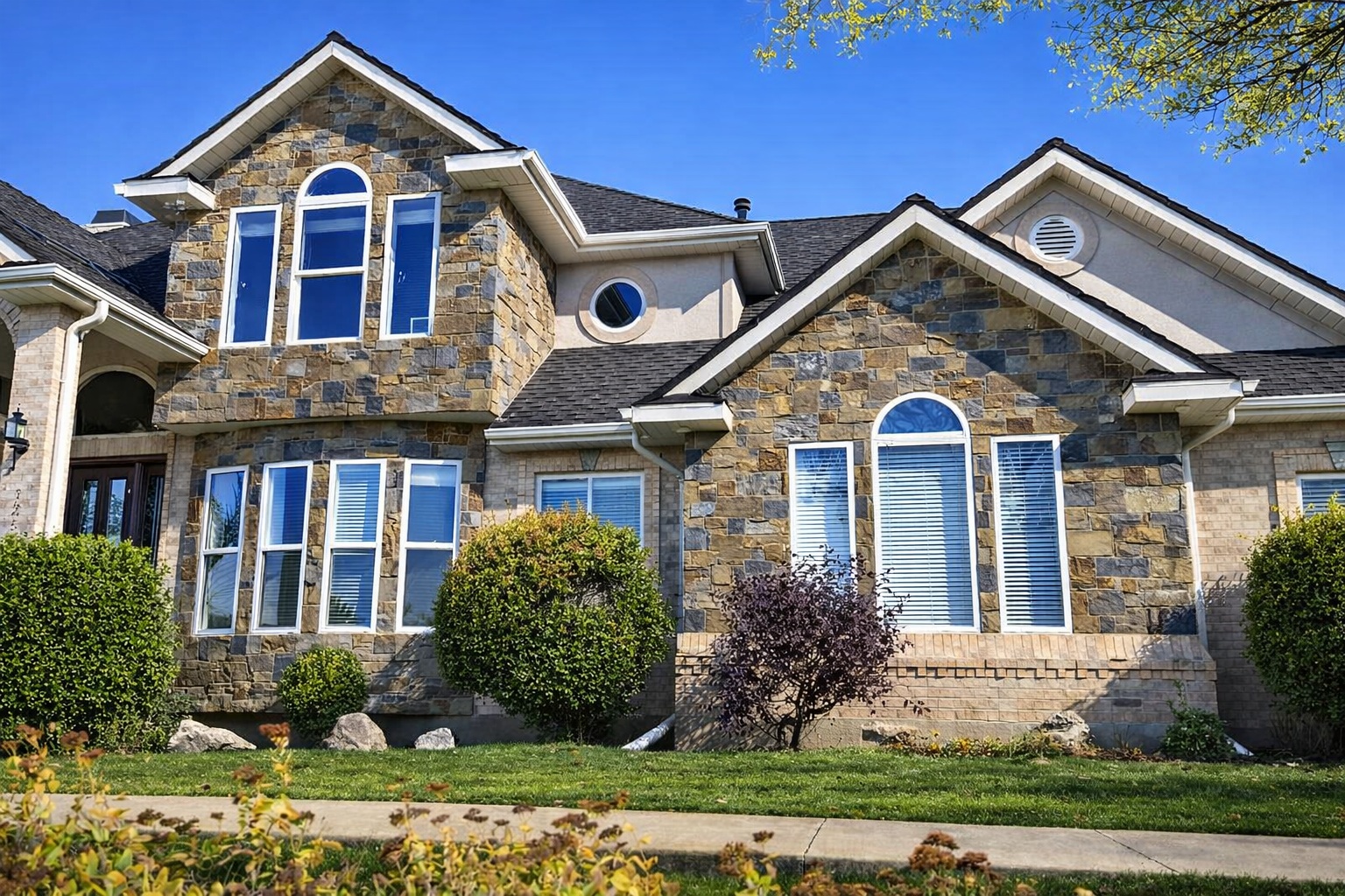 Brick and stone masonry home exterior