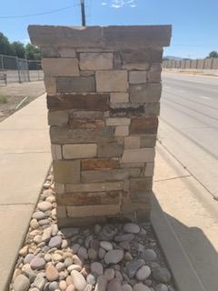 Stone column detail with stacked masonry texture