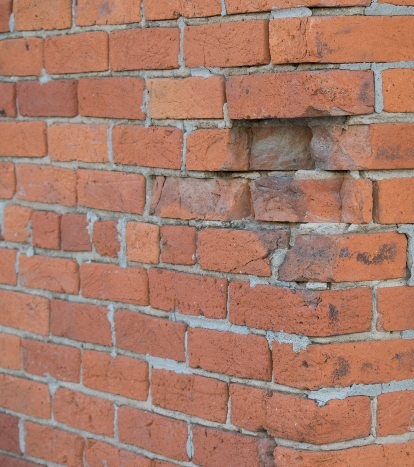 Brick wall before tuckpointing repair